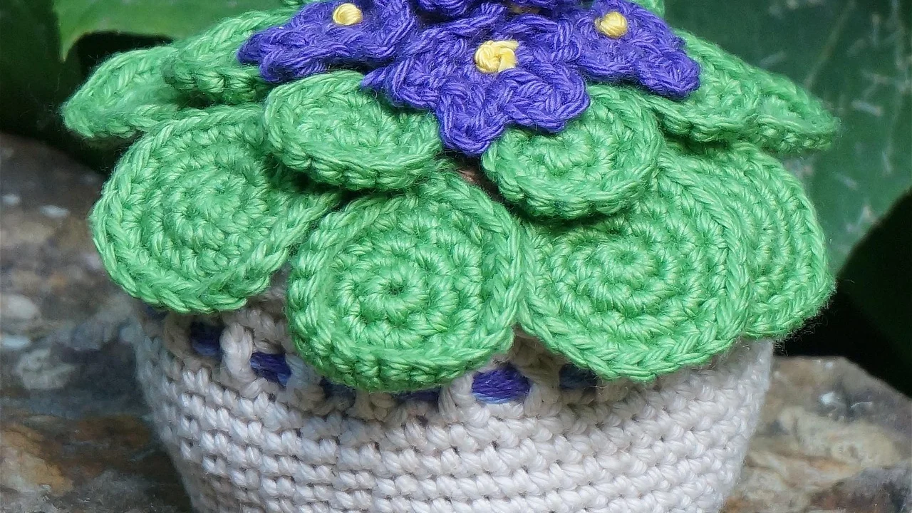 Detalhe de símbolo sankofa impresso em tecido africano.